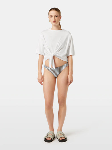 White knotted sweater