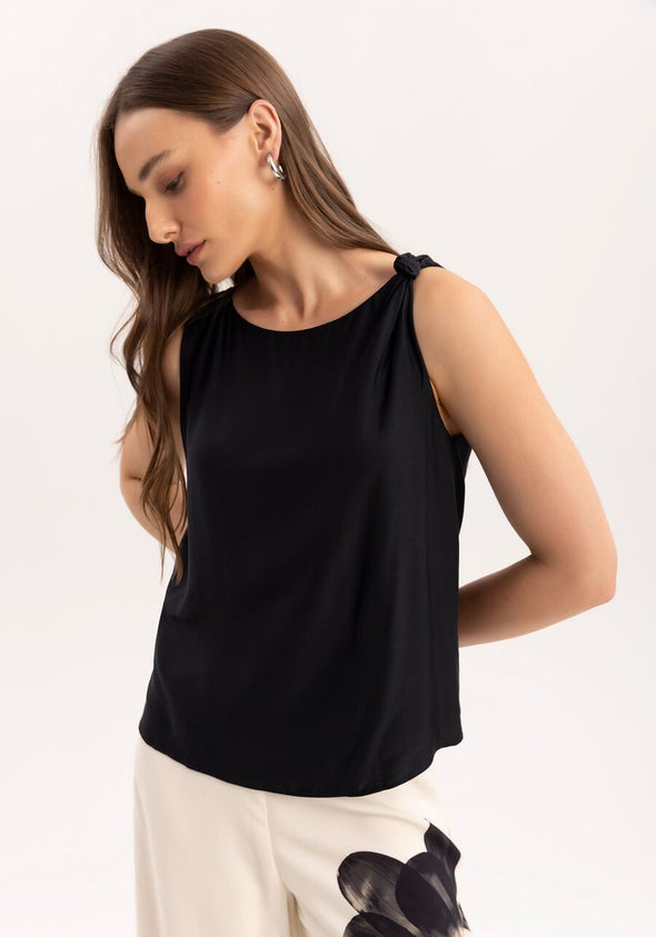 top with bow on shoulder